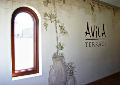 Photo of a wall with the Avila Terrace logo.